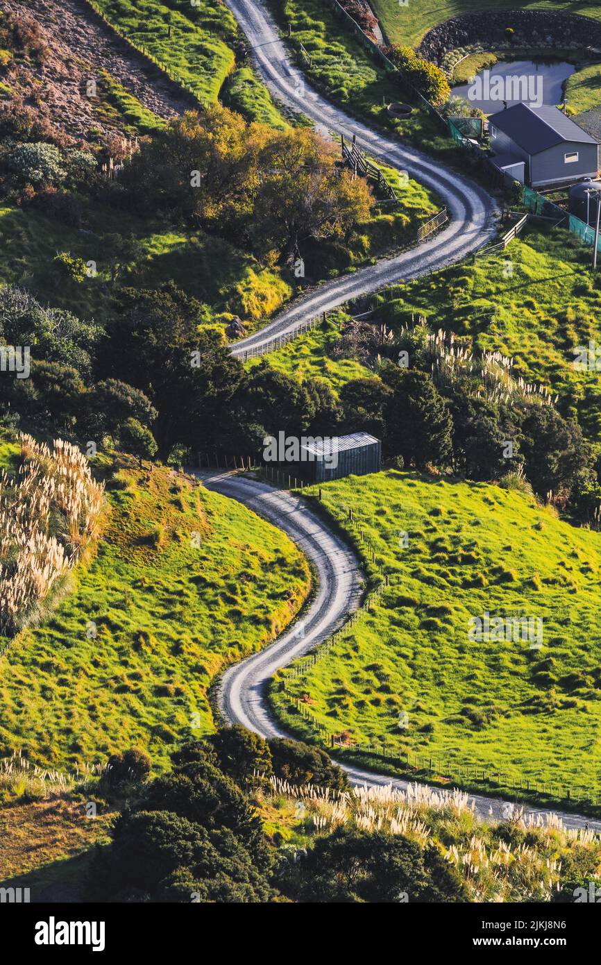 A aerial shot of the asphalt road from the high point of Mount Manaia