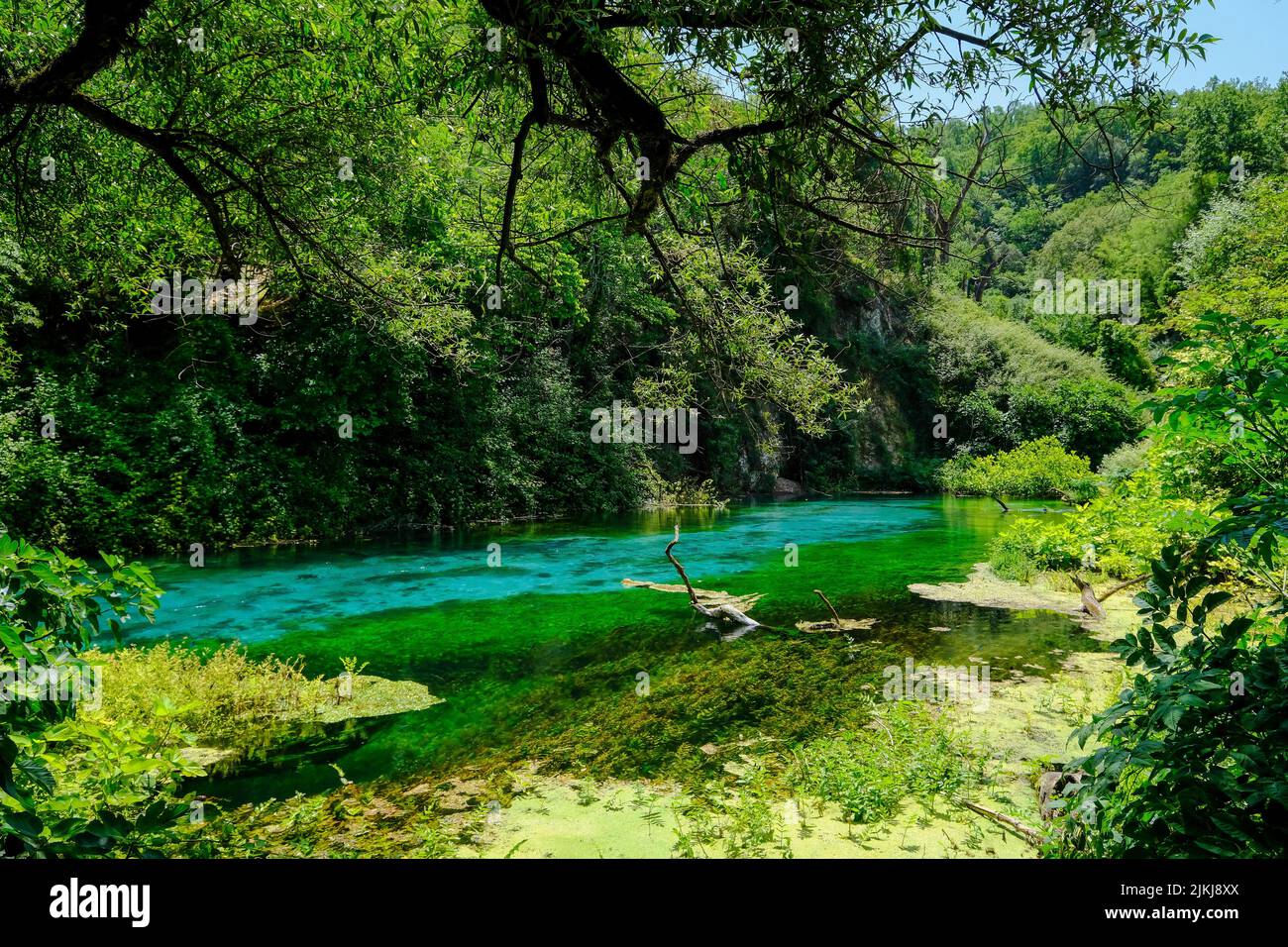 Muzina, Albania - Syri i Kaltër, BLUE EYE, with 6 ö³/s the most abundant source of water in the country, it is located midway between the larger cities of Saranda on the coast and Gjirokastra in the interior. Stock Photo