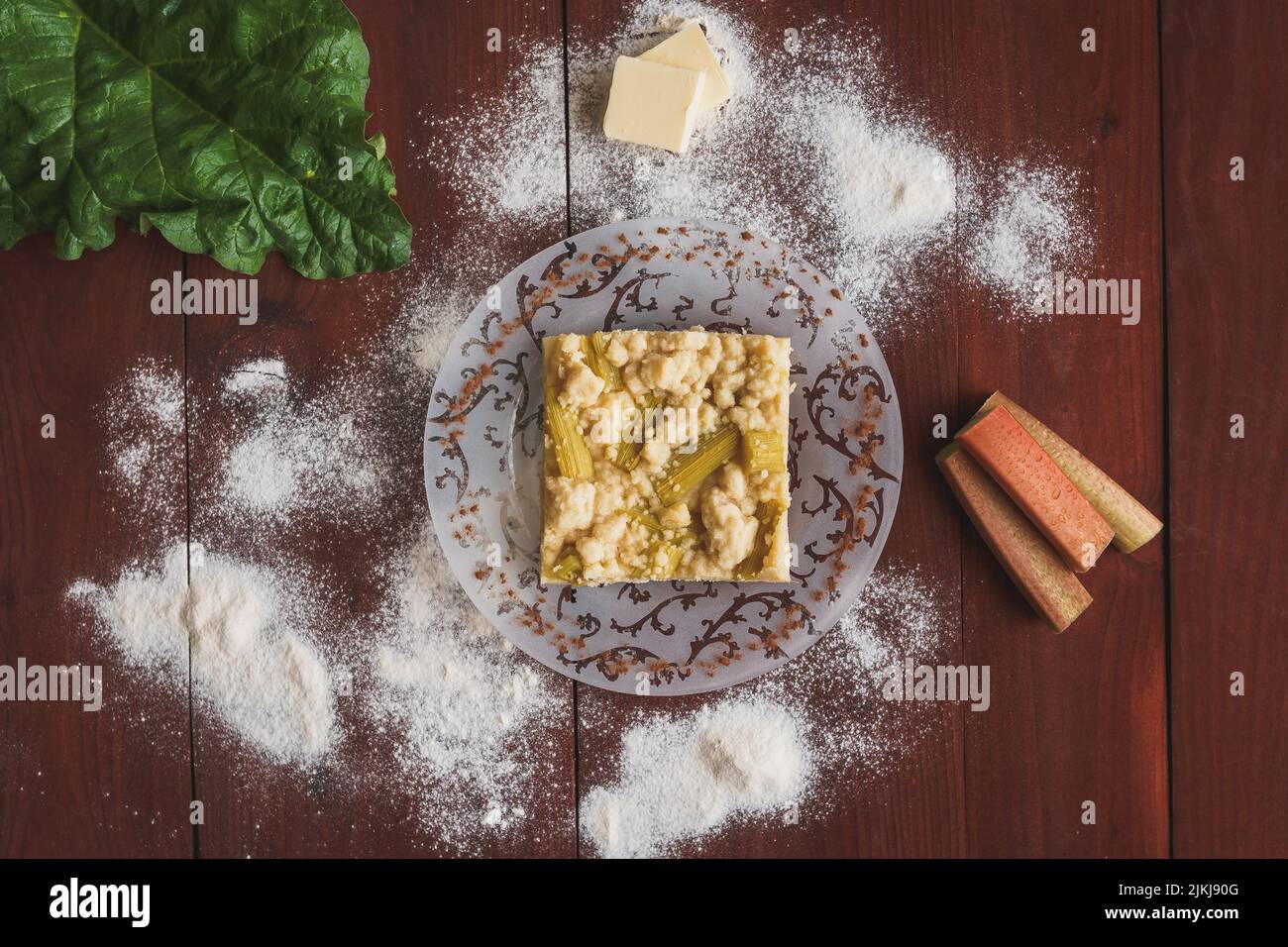 A top view of a Rhubarb cake on a wooden surface Stock Photo