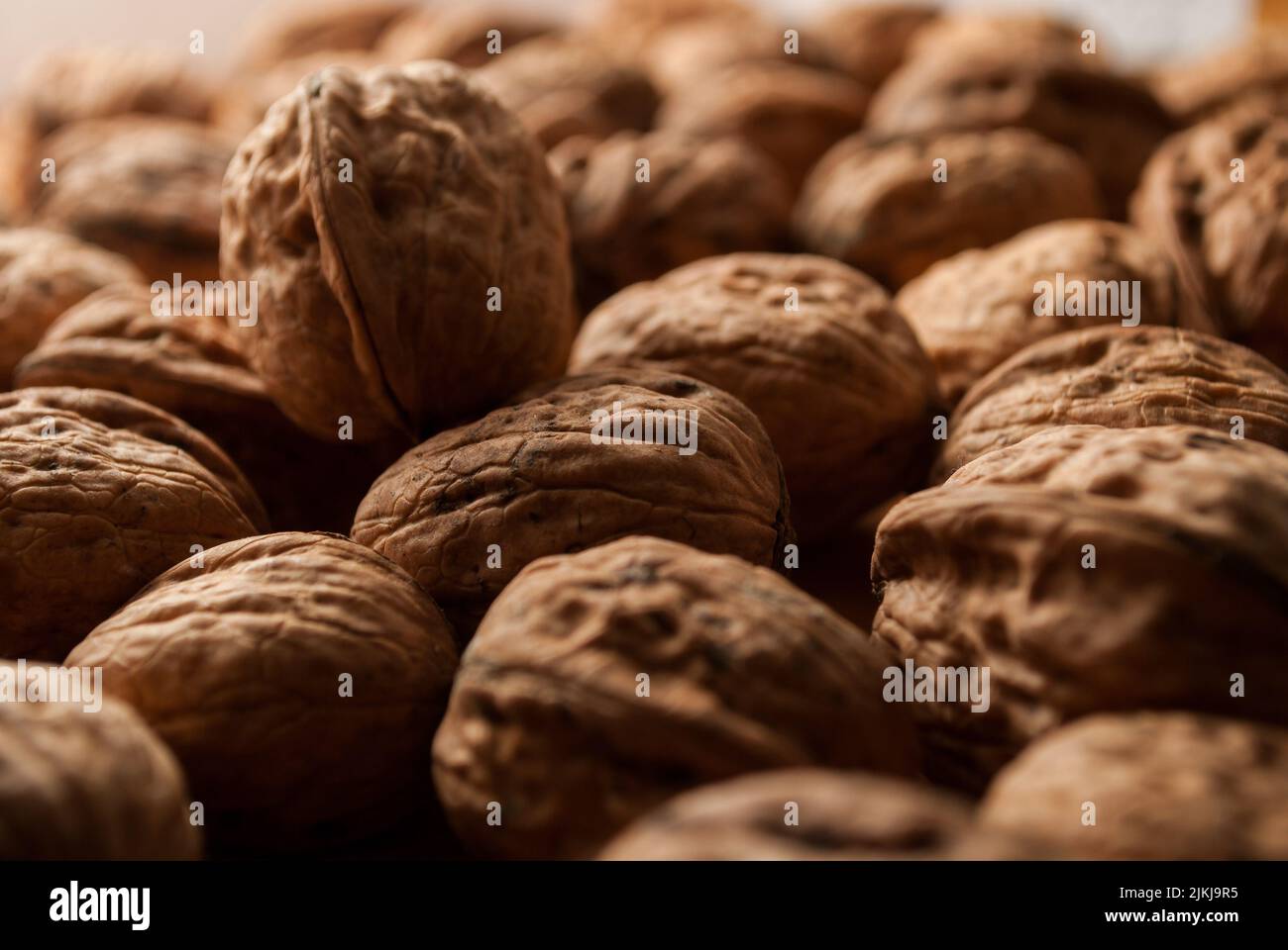 A closeup of a pile of shells of walnuts Stock Photo