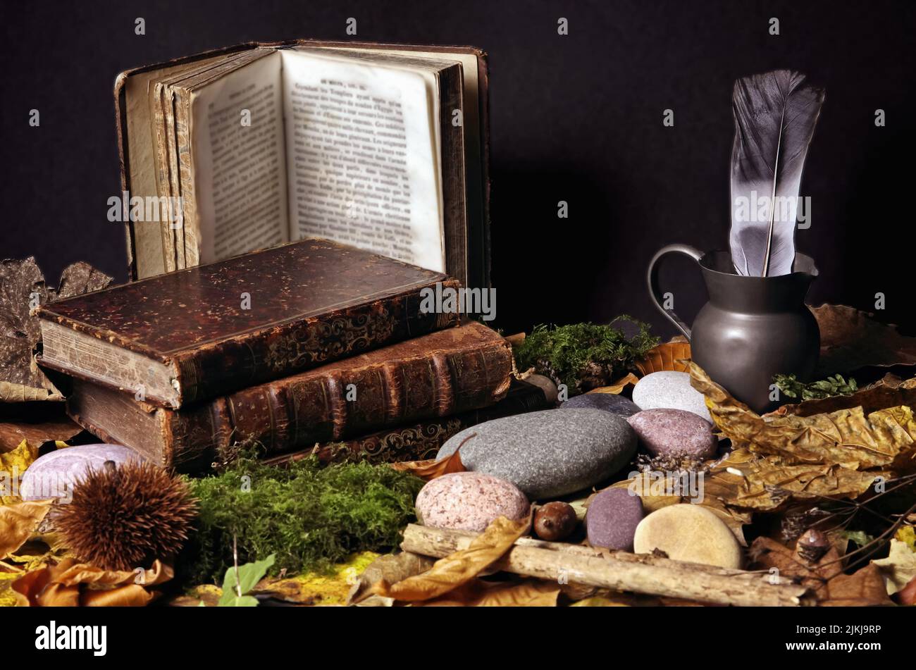 A Still life shot of old books with leather covers on a table with ...