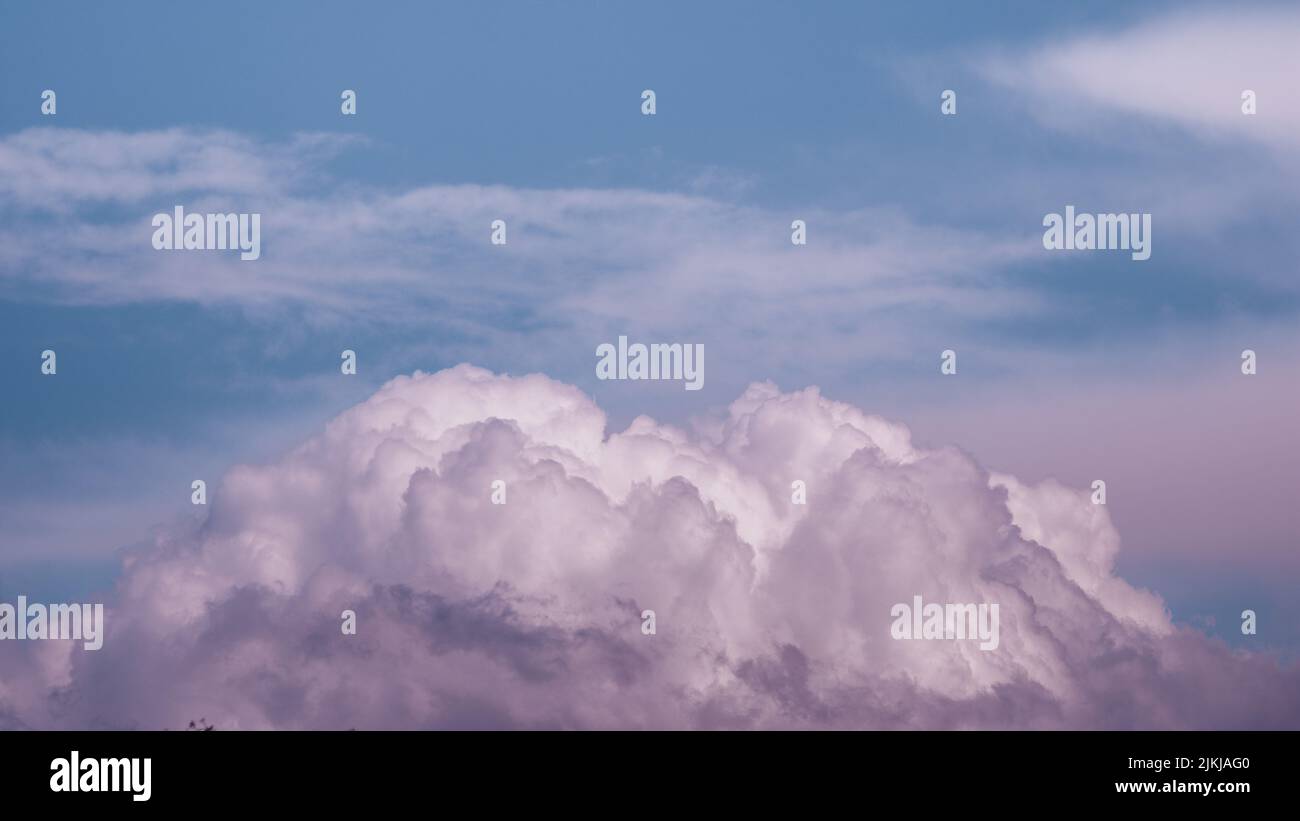 A mesmerizing cloudscape in purple-blue shades Stock Photo