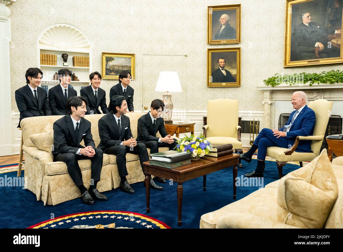 President Joe Biden records a digital video with the K-pop singing group BTS Tuesday, May 31, 2022, in the Oval Office of the White House.  (Official White House Photo by Adam Schultz) Stock Photo