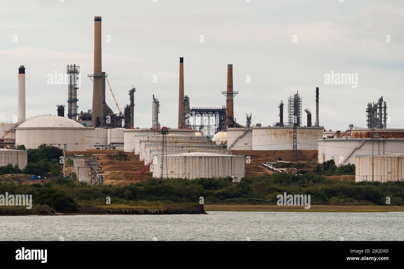 Southampton, southern England, UK. An exterior view of Fawley refinery, storage tanks and chimneys on Southampton Water, UK. Stock Photo