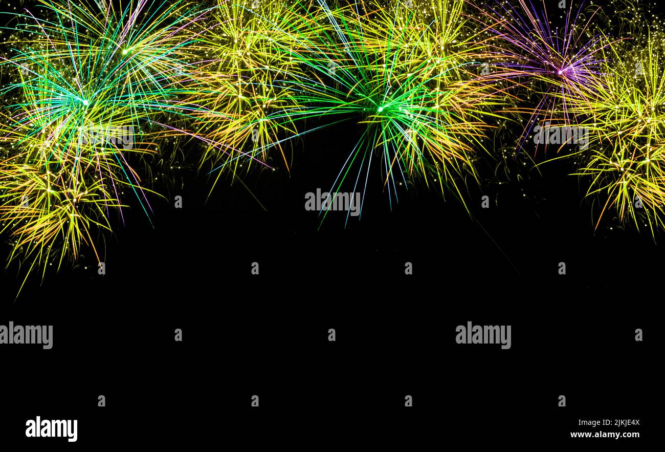 A scenic view of colorful fireworks in the black night sky Stock Photo