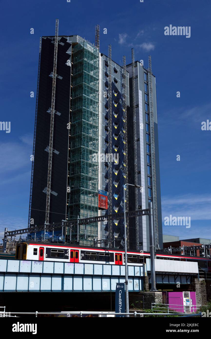 Train and modern buildings, Cardiff Stock Photo