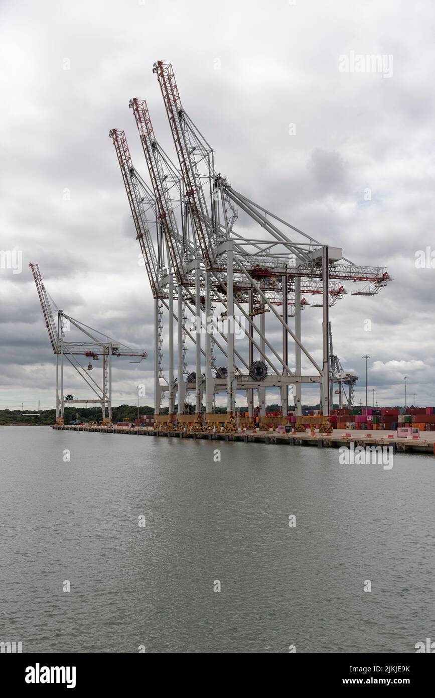 Southampton, England, UK. 2022. Large cranes waterside at a container ship terminal in southern England. Stock Photo