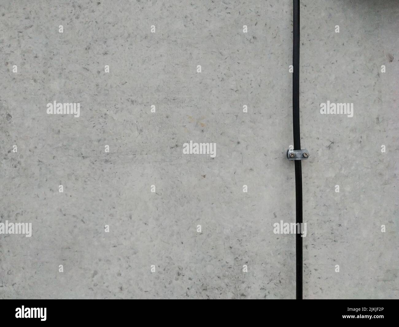 A concrete wall with a black wire background texture Stock Photo