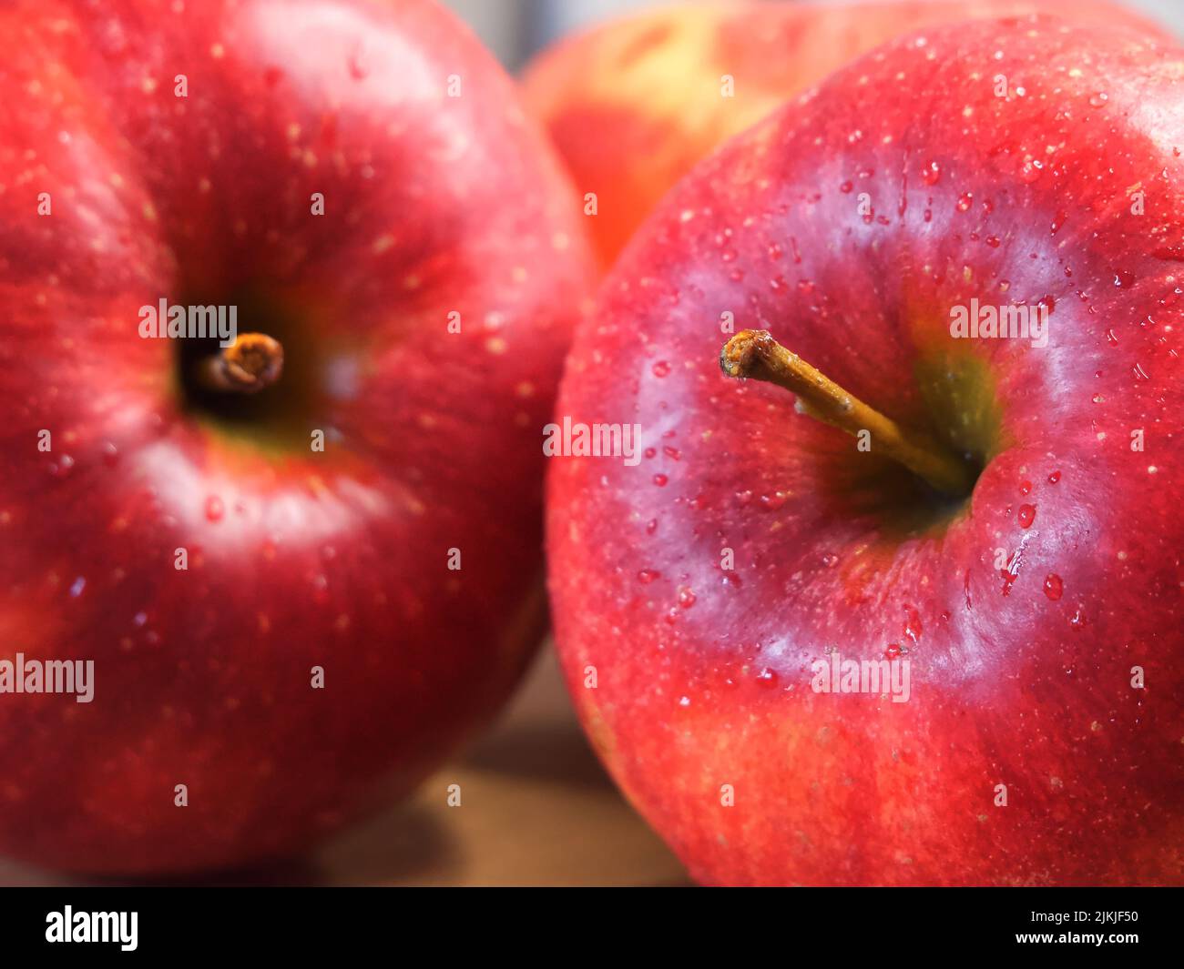Delicious red apples photographed in macro. Ripe fruit. Stock Photo