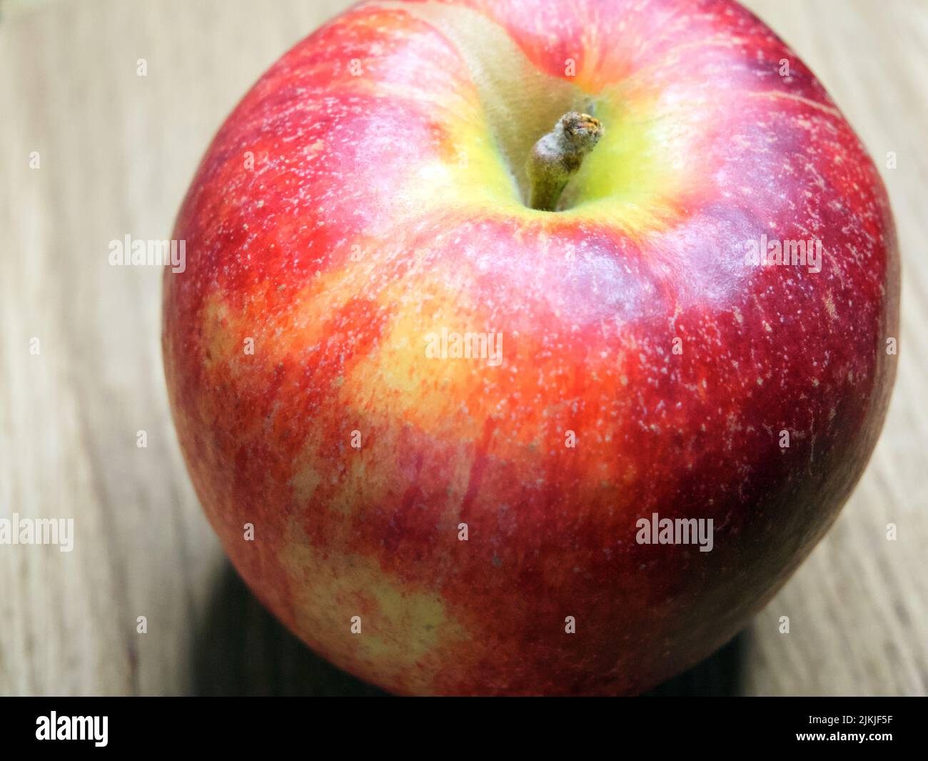 A  single large ripe gala apple, a macro  shot. Stock Photo
