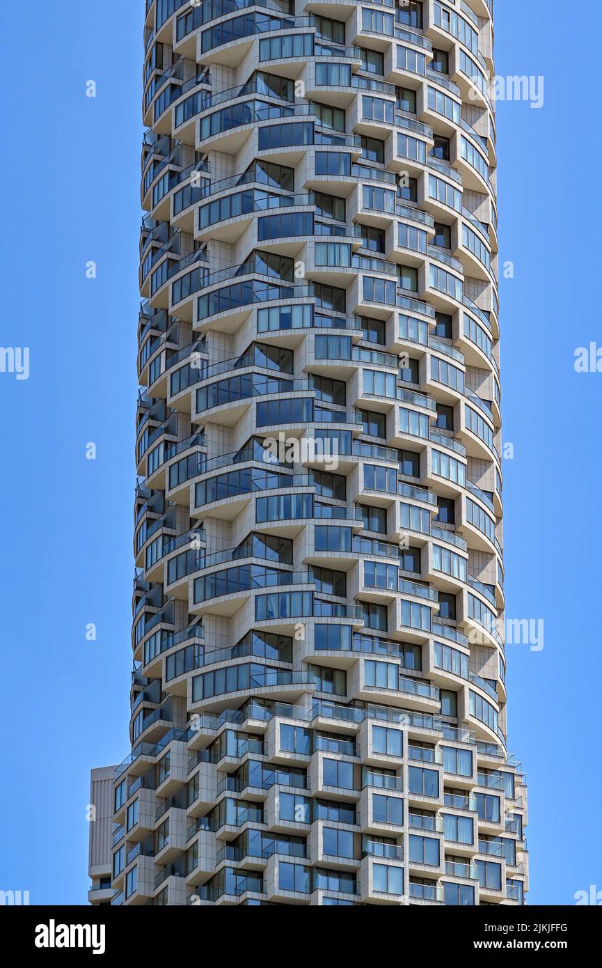 London, England - June 2022: Exterior view of a tall block of apartments in Canary Wharf. Stock Photo