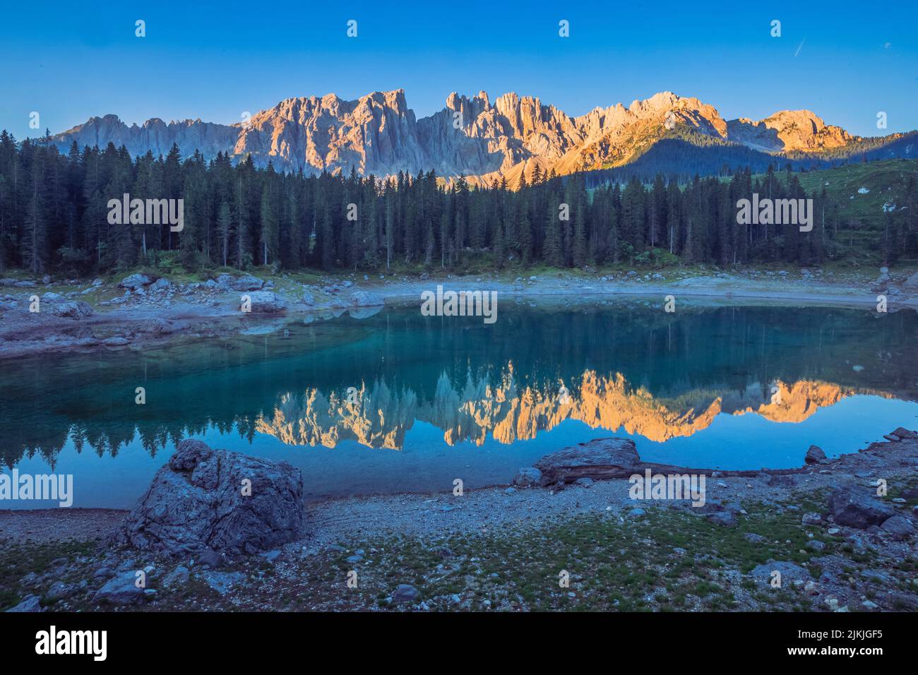 Italy, Trentino South Tyrol, Bolzano, the alpine lake of Carezza / Karersee with the Latemar mountain range, Dolomites Stock Photo