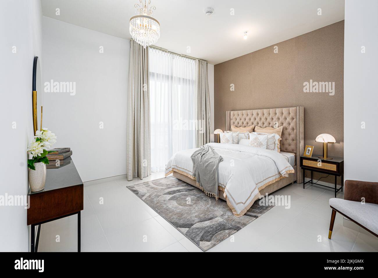 The modern apartment bedroom interior design with a brown bed and small carpet Stock Photo Alamy
