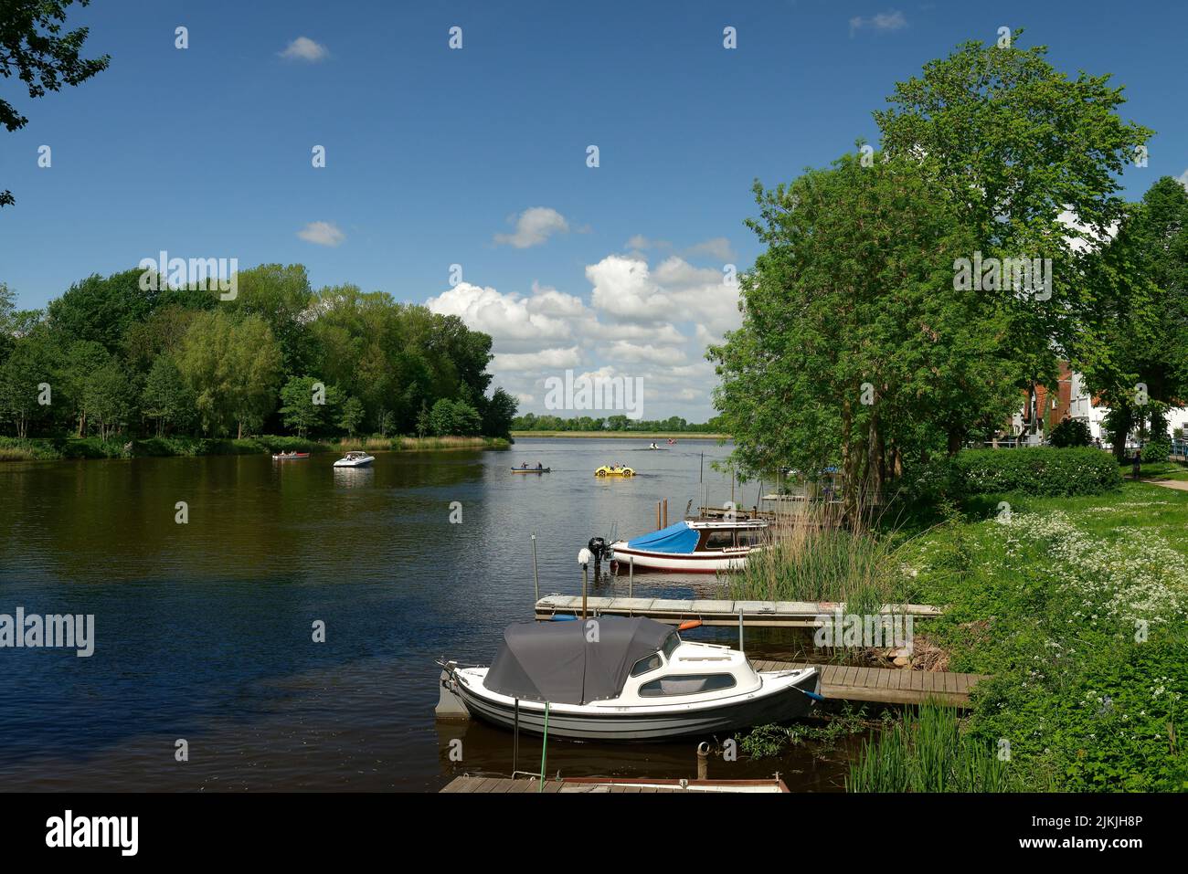 Boats at the Westersielzug in view of the river Treene, Friedrichstadt, the Dutch town on the peninsula Eiderstedt, North Frisia, peninsula Eiderstedt, Schleswig-Holstein, Germany Stock Photo