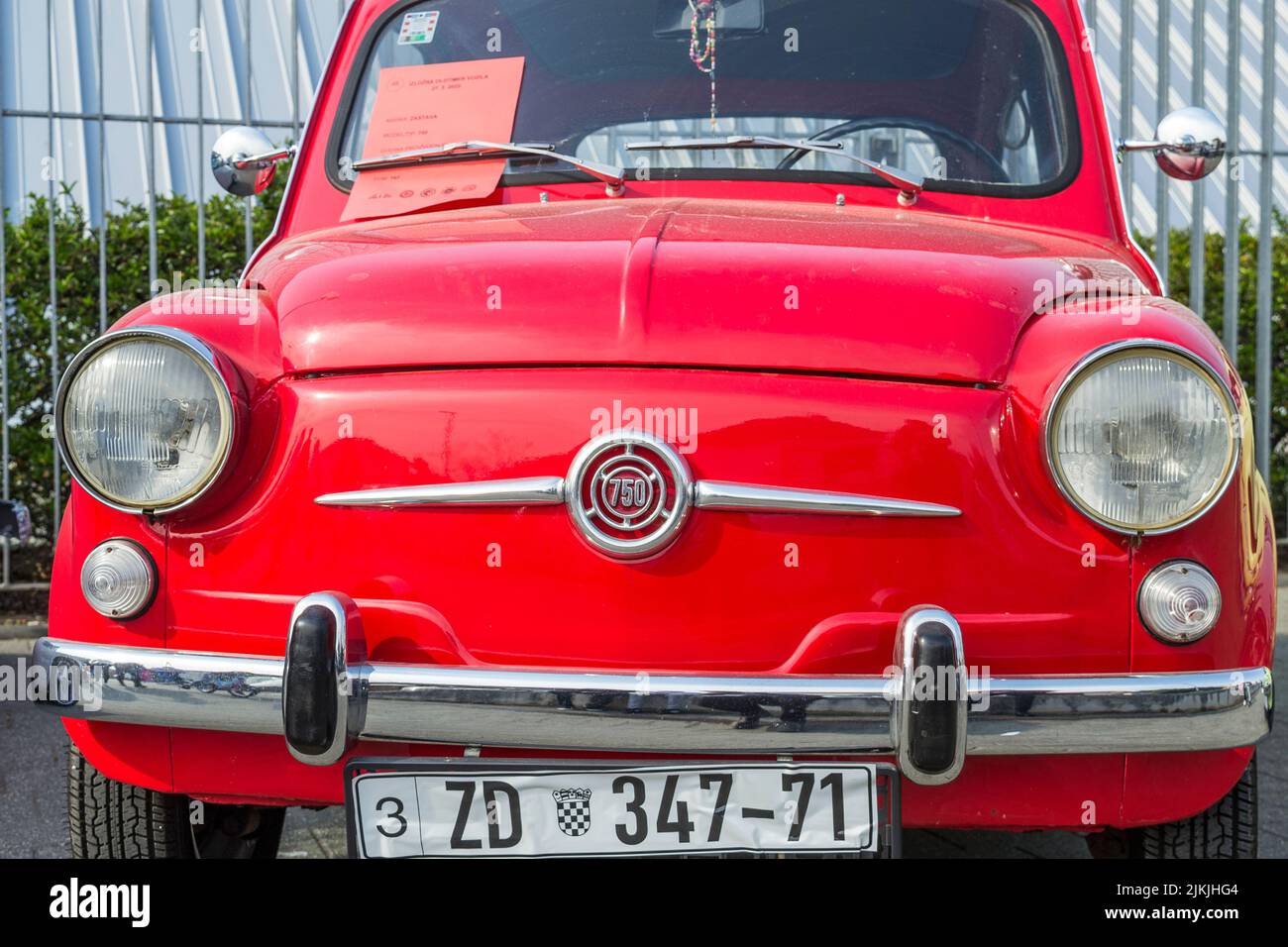 A front shot of a red Zastava 750 old-timer city car on classical car exhibition Stock Photo