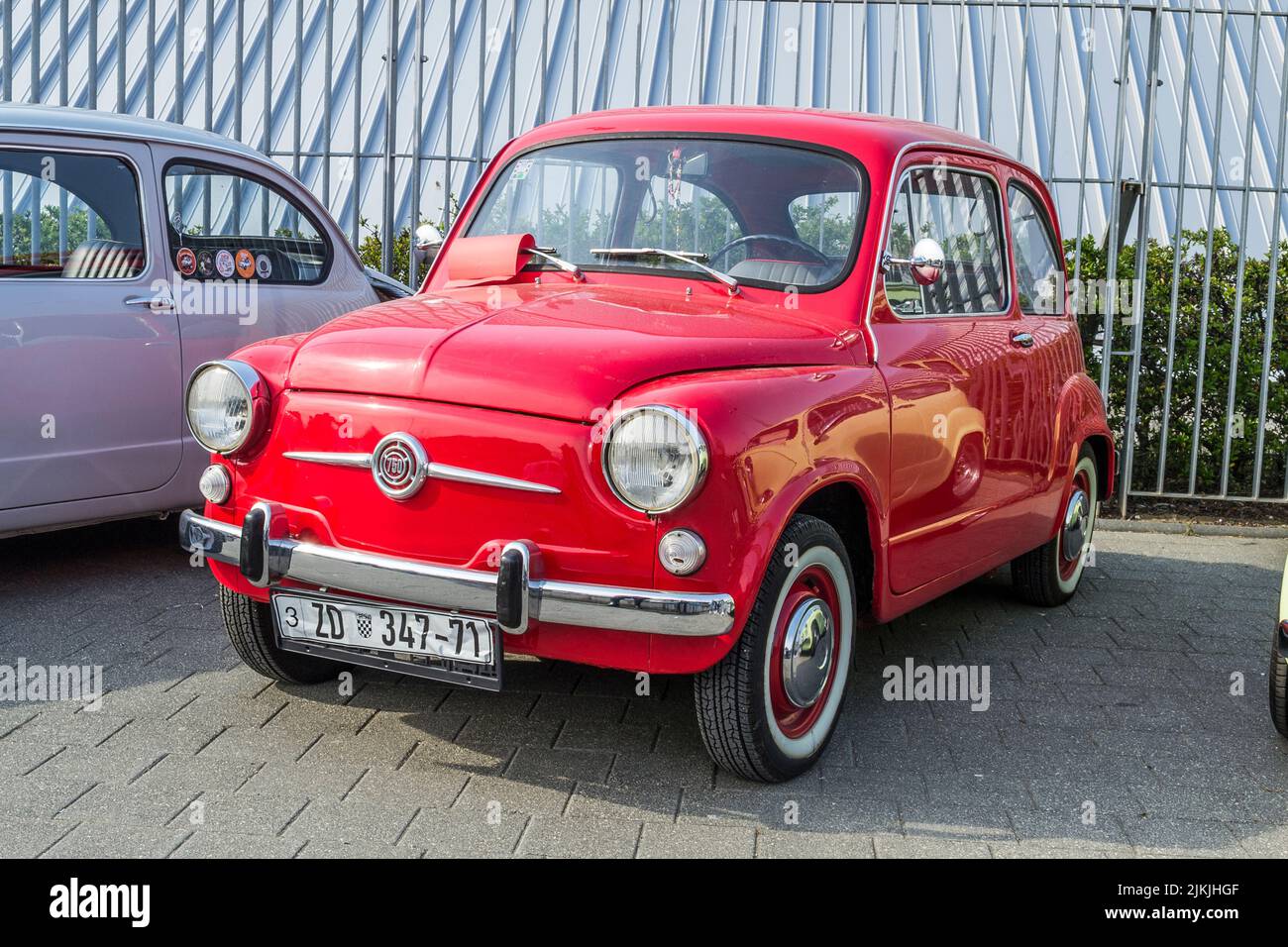 A Side shot of a red Zastava 750 old-timer city car on classical car exhibition Stock Photo