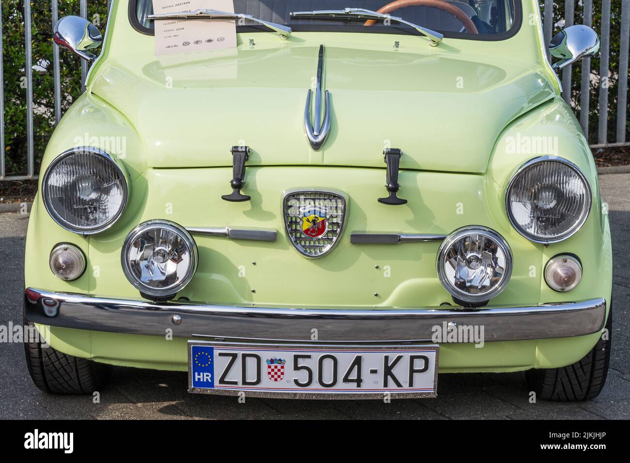 A front shot of a green Zastava 750 old-timer city car on classical car exhibition Stock Photo
