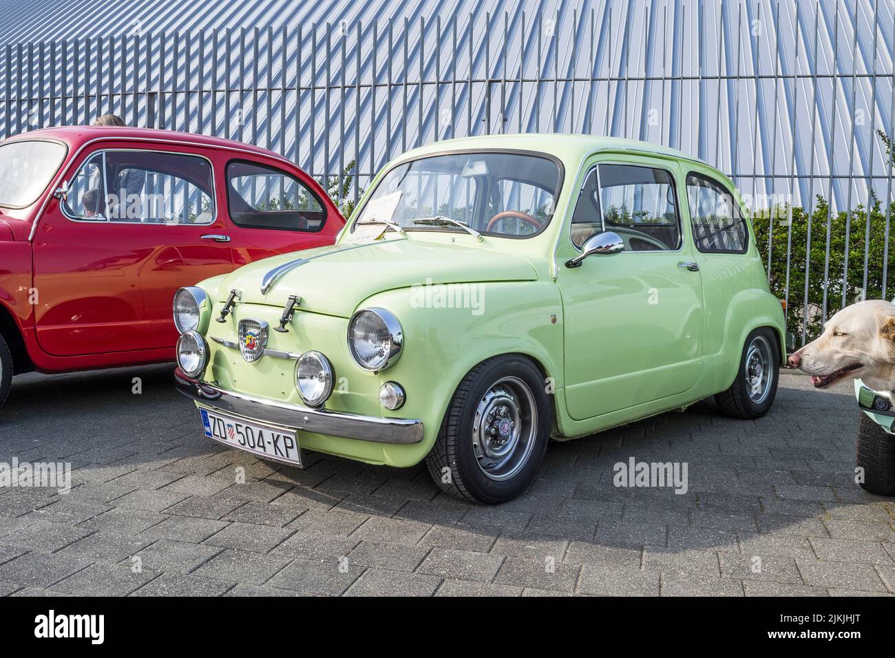 A side shot of a green Zastava 750 old-timer city car on classical car exhibition Stock Photo