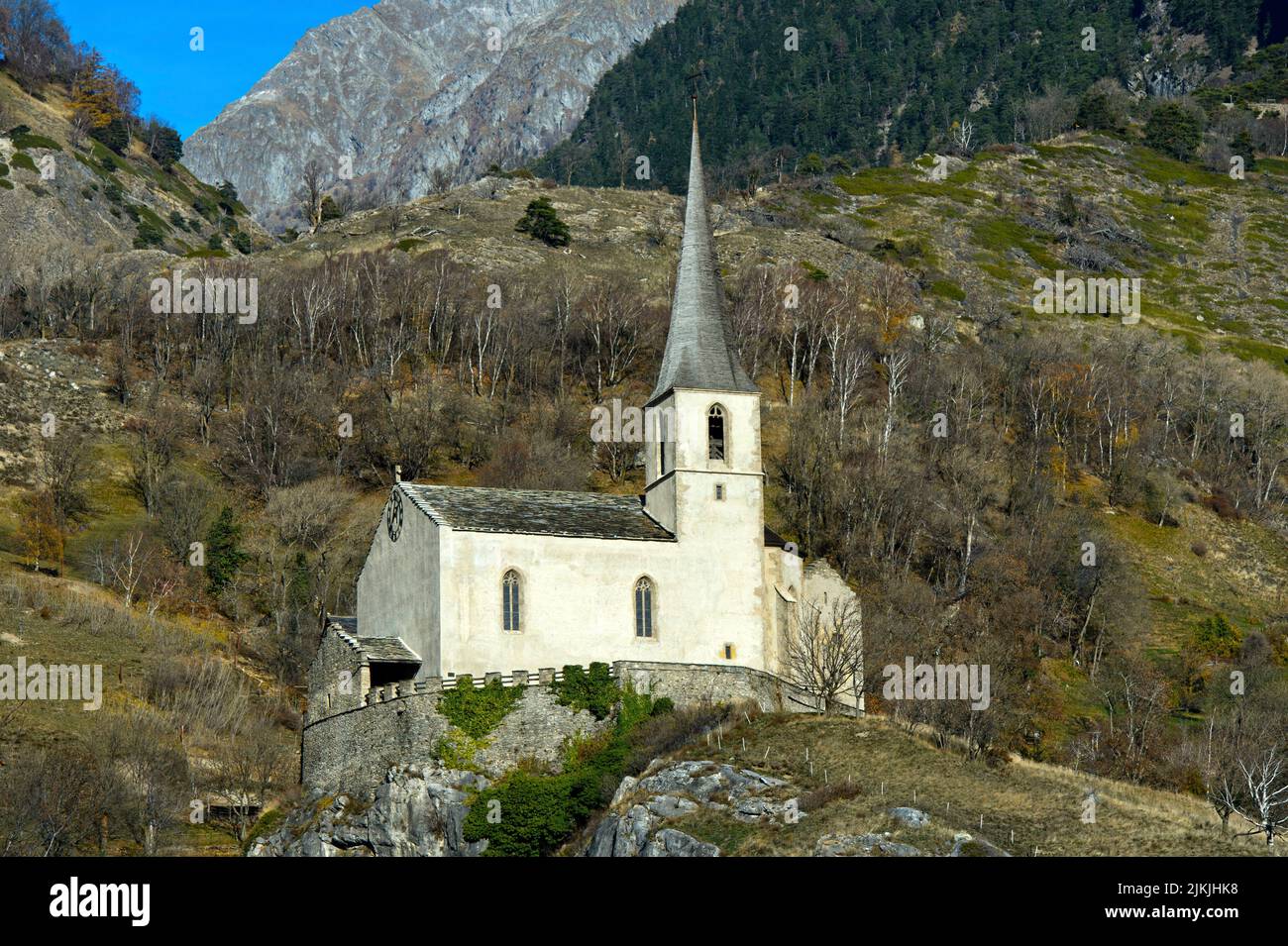 The medieval church of St. Romanus on the castle rock, burial church of the poet Rainer Maria Rilke, Raron, Valais, Switzerland Stock Photo