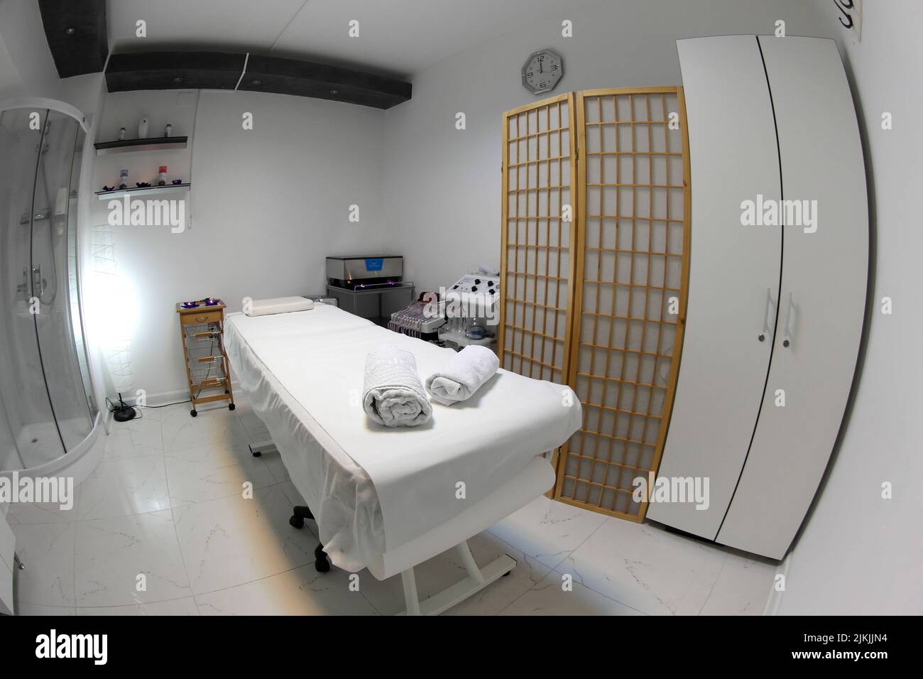 The interior of the massage room, massage table in the spa, skin treatment. Stock Photo
