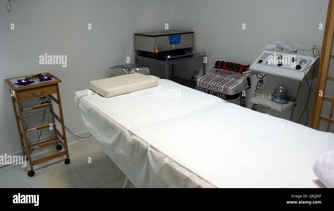 The interior of the massage room, massage table in the spa, skin treatment. Stock Photo