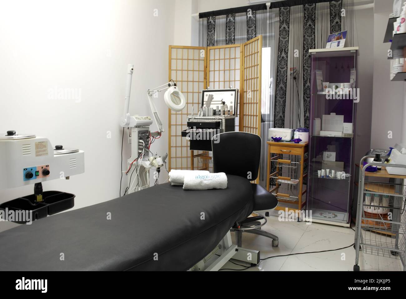The interior of the massage room, massage table in the spa, skin treatment. Stock Photo
