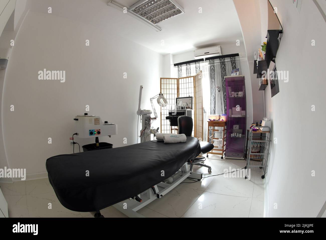 The interior of the massage room, massage table in the spa, skin treatment. Stock Photo