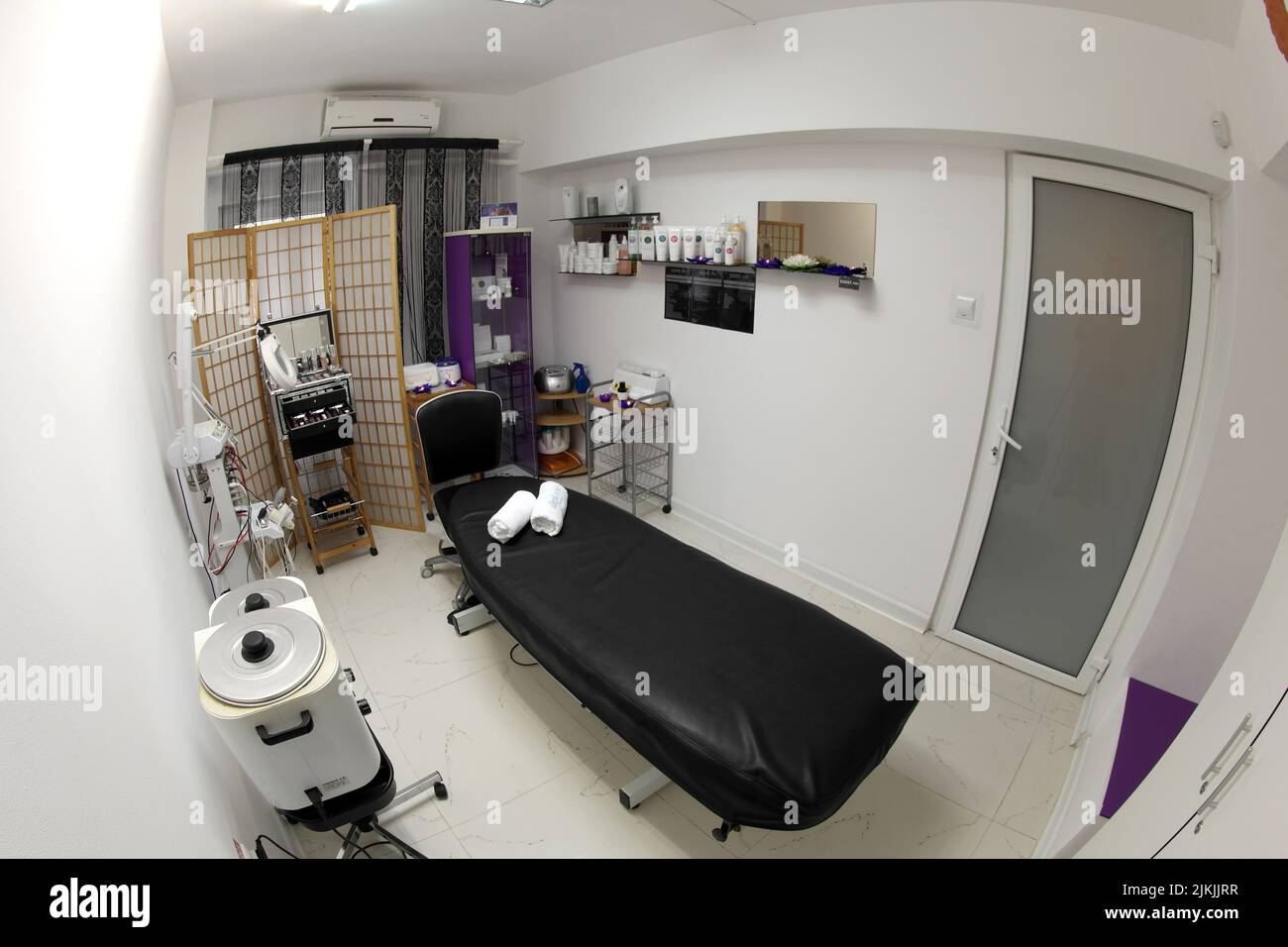 The interior of the massage room, massage table in the spa, skin treatment. Stock Photo