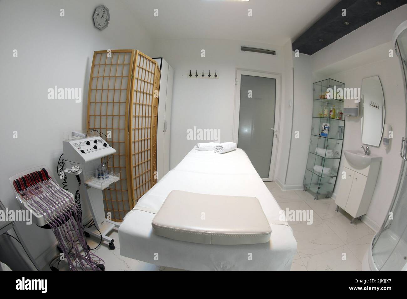 The interior of the massage room, massage table in the spa, skin treatment. Stock Photo