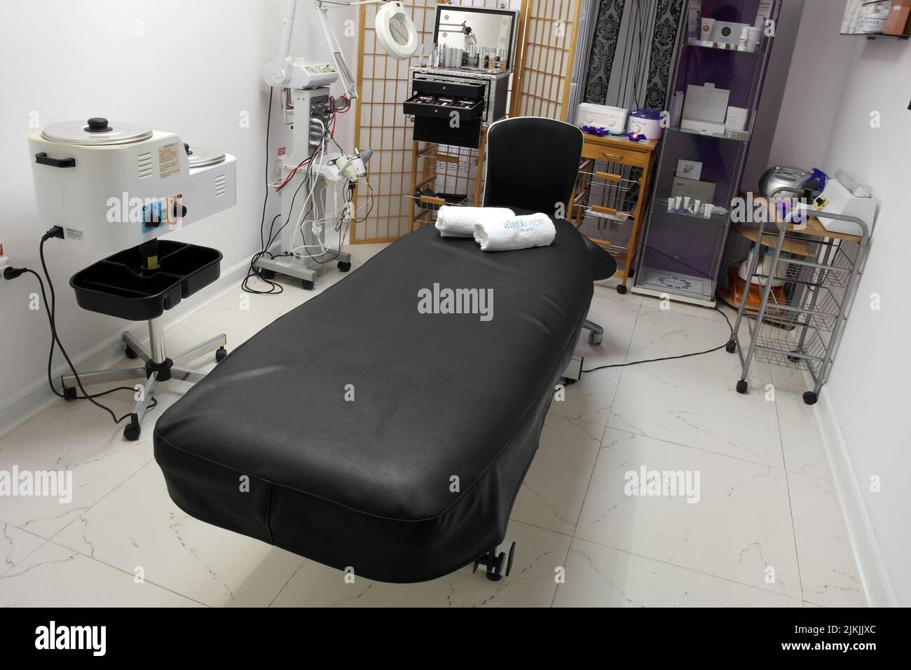 The interior of the massage room, massage table in the spa, skin treatment. Stock Photo