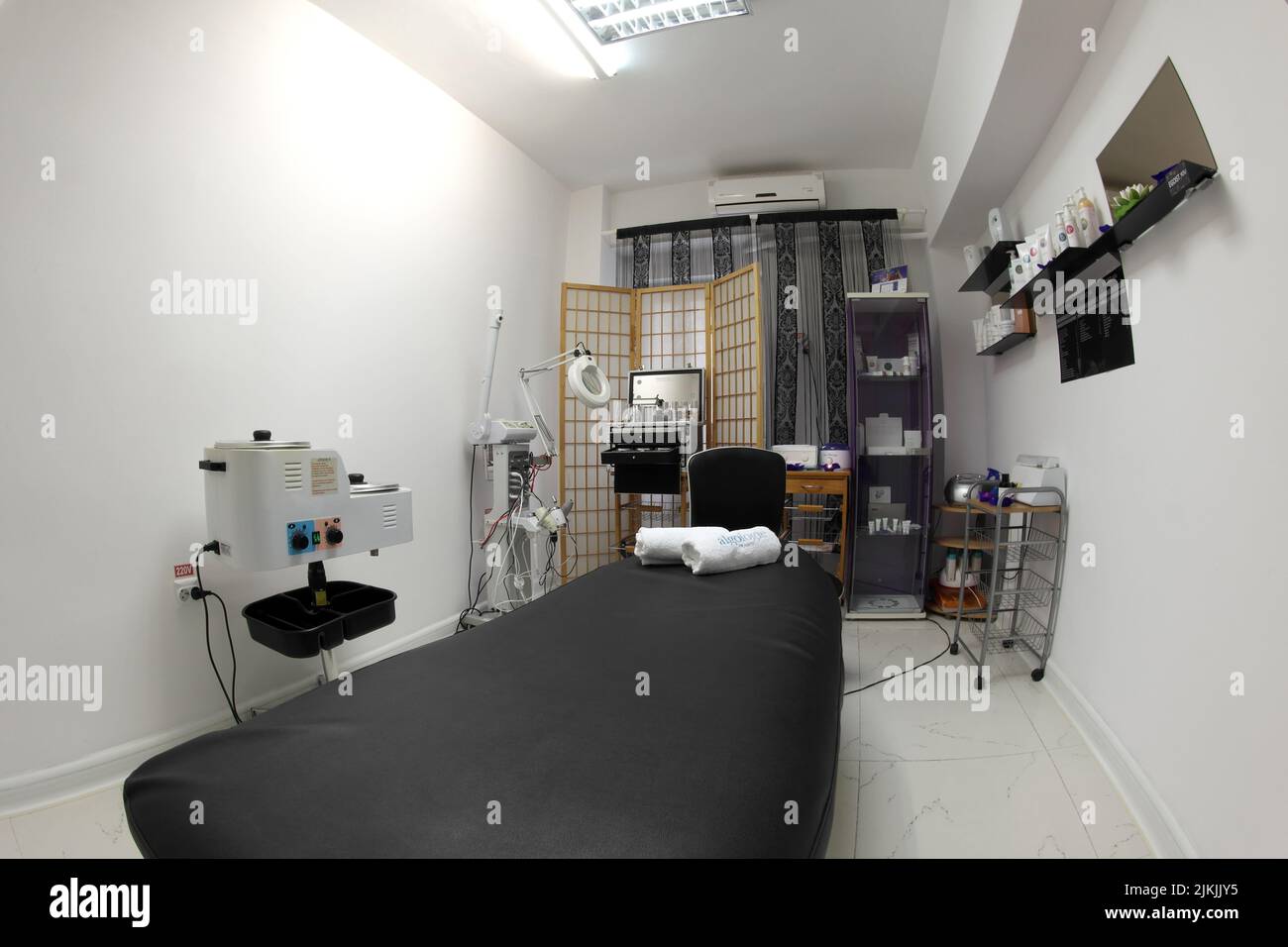 The interior of the massage room, massage table in the spa, skin treatment. Stock Photo