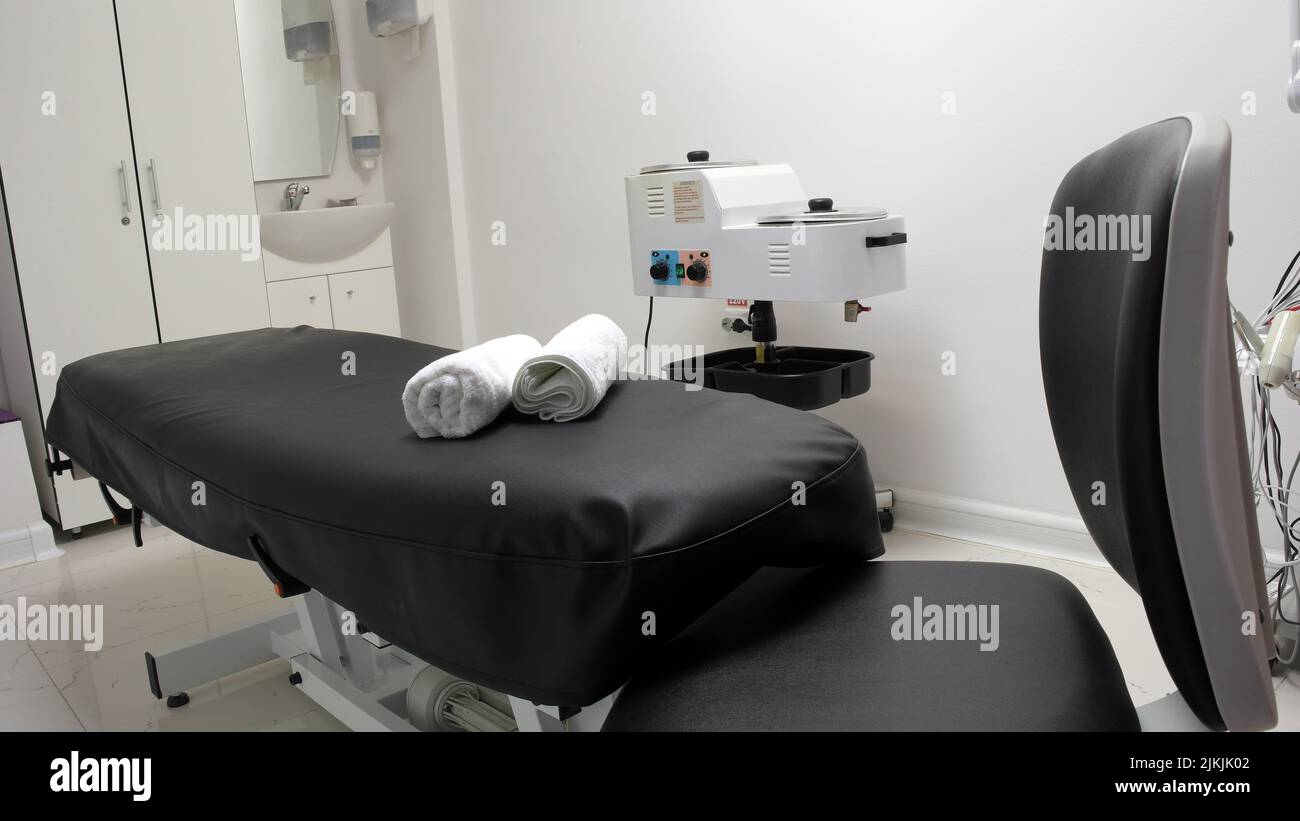 The interior of the massage room, massage table in the spa, skin treatment. Stock Photo
