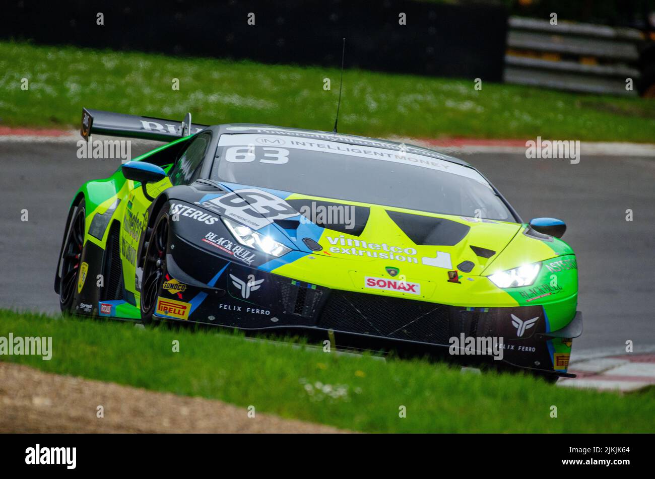 A low angle shot of a Lamborghini Orocan green car car during the race in the British GT Championship, Stock Photo