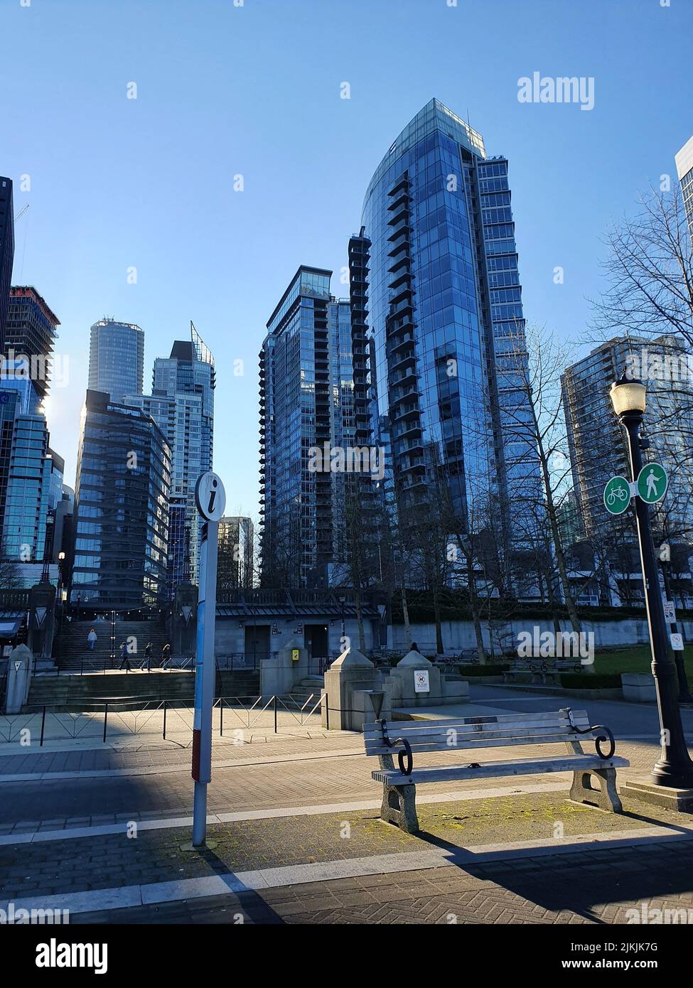 A beautiful view of the modern tall buildings from a park under the blue sky Stock Photo