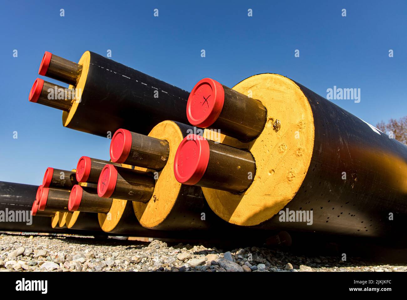 Black pipes for local heating are stacked for laying Stock Photo Alamy