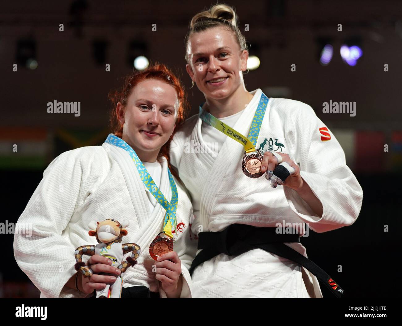 Wales' Jasmine Hacker-Jones (left) and Australia's Katharina Haecker after winning bronze in the Women's -63 kg Final at Coventry Arena on day five of the 2022 Commonwealth Games. Picture date: Tuesday August 2, 2022. Stock Photo