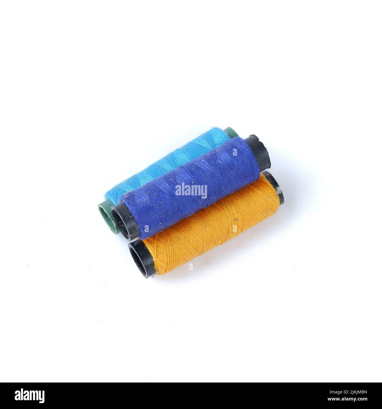 sewing thread isolated on a white background Stock Photo - Alamy
