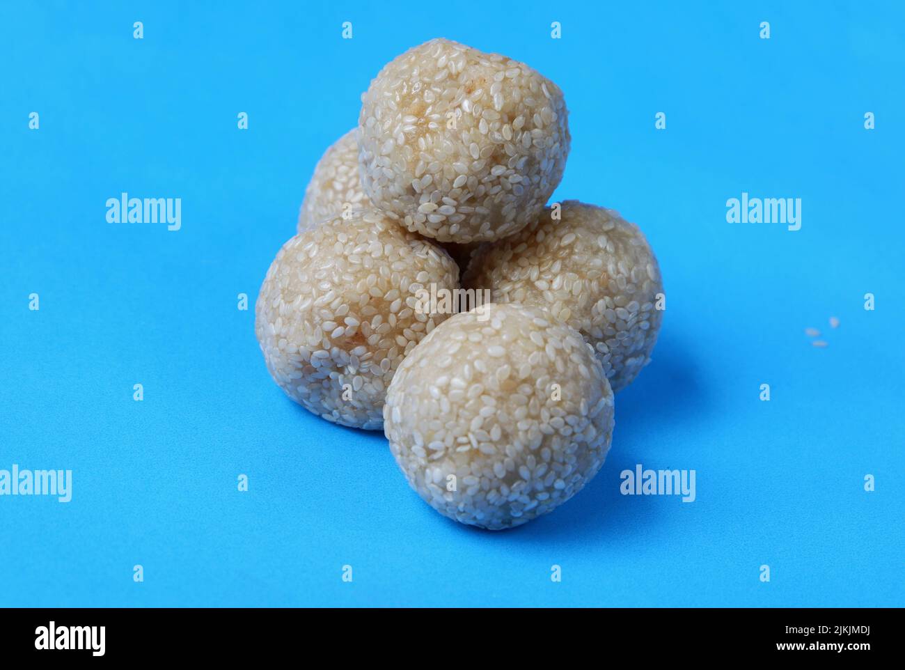Onde onde. Traditional Indonesian food, isolated on a blue background Stock Photo