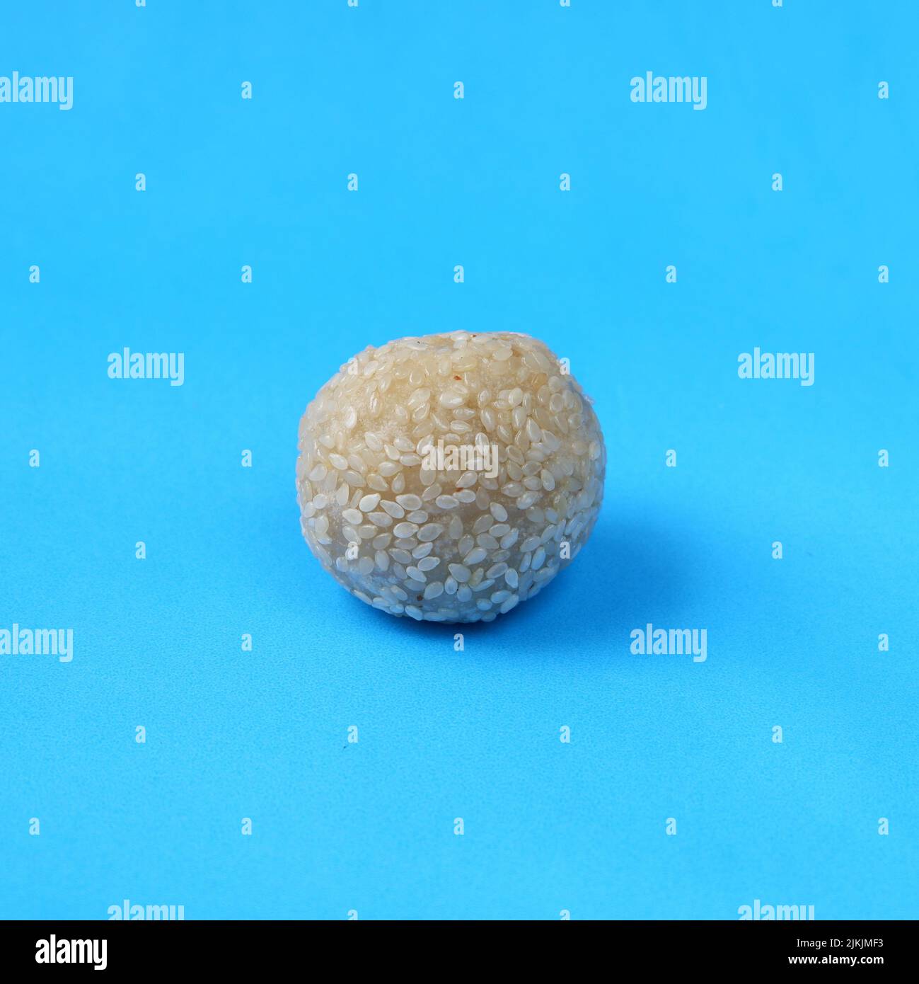 Onde onde. Traditional Indonesian food, isolated on a blue background Stock Photo