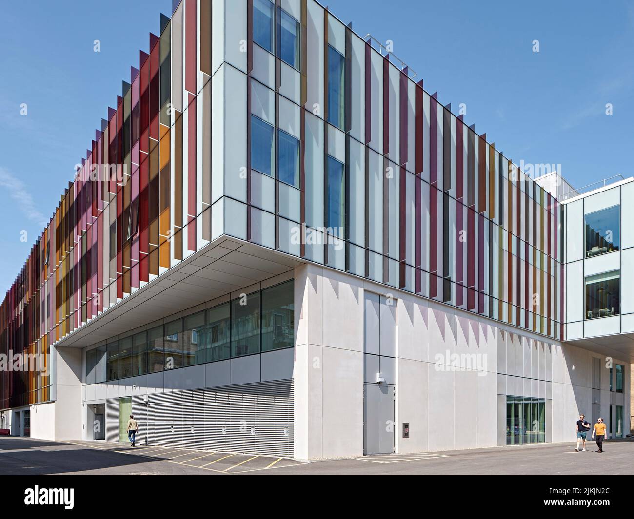 Exterior facade, partially wrapped in colourful glass. Dorothy Crowfoot Hodgkin Building, Oxford, United Kingdom. Architect: Hawkins Brown Architects Stock Photo