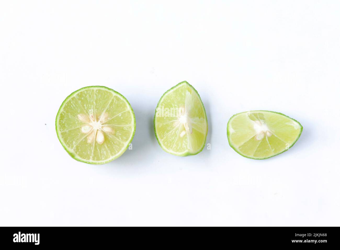 lime with slices isolated on white background Stock Photo