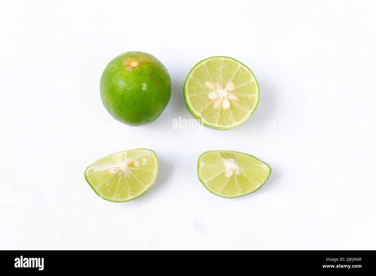 lime with slices isolated on white background Stock Photo