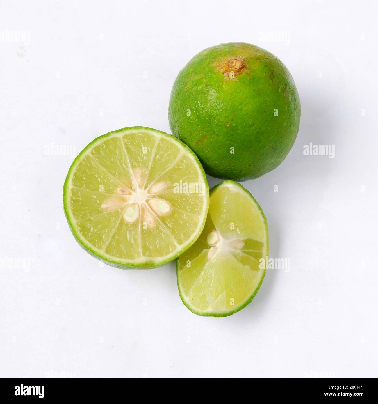 lime with slices isolated on white background Stock Photo