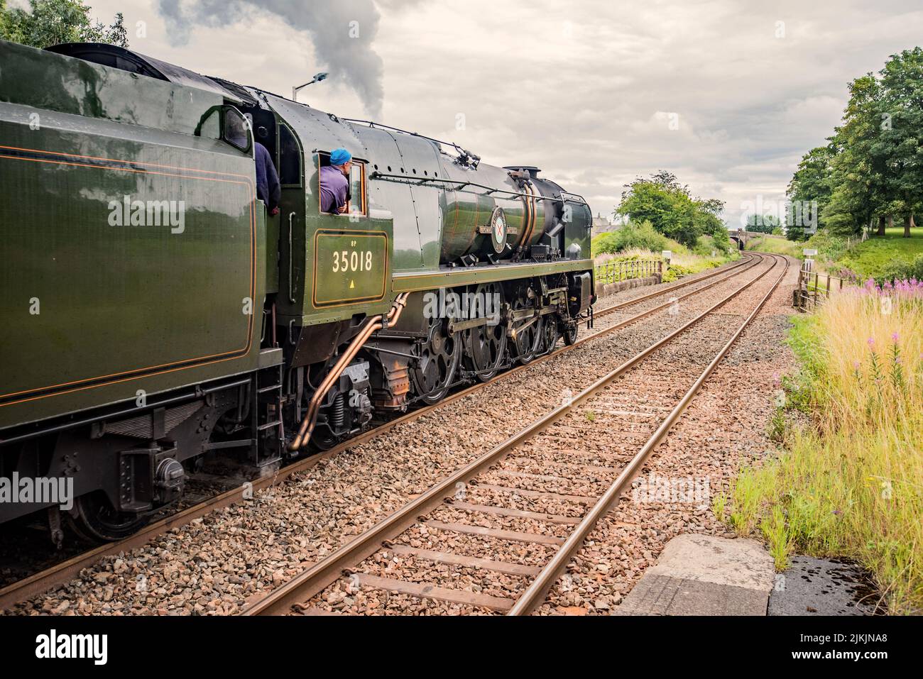 British India Line steam locomotive on the Settle & Carlisle line passing through Long Preston on 2nd August 2022. Stock Photo