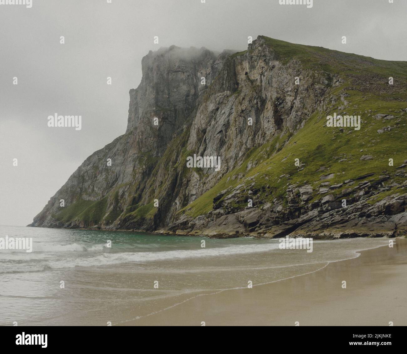 A beautiful misty landscape on Kvalvika beach, Lofoten, Norway Stock Photo