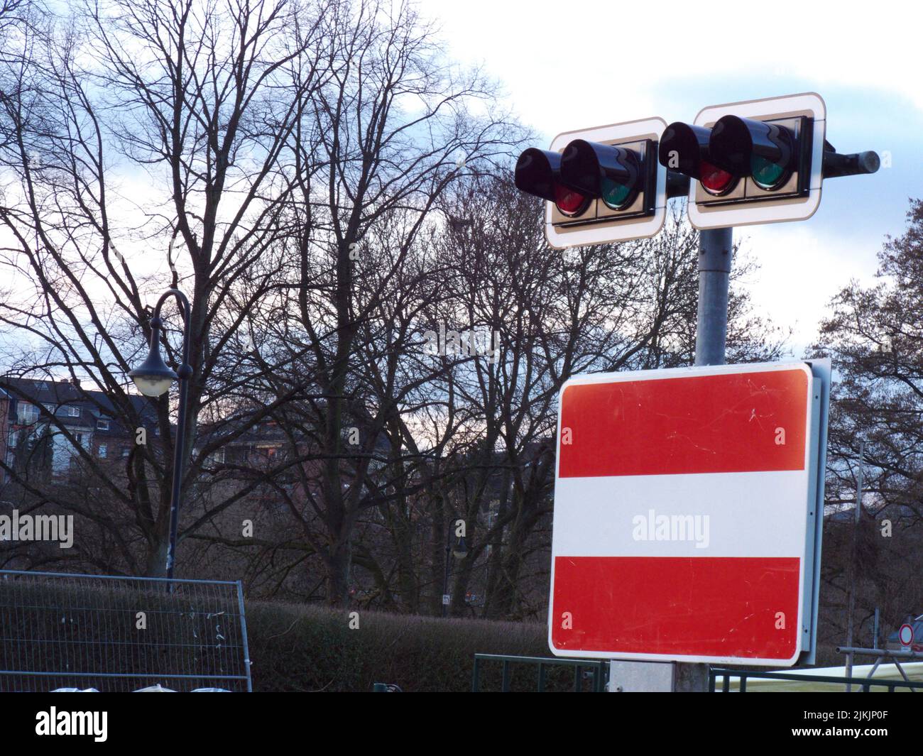 A navigational sign and traffic lights on a street Stock Photo - Alamy