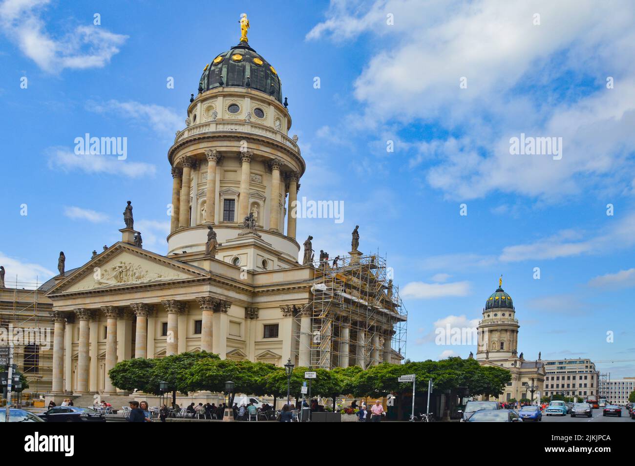 A beautiful shot of the German church at Gendarmenmarkt square against blue sky on a sunny day in Berlin, Germany. Stock Photo