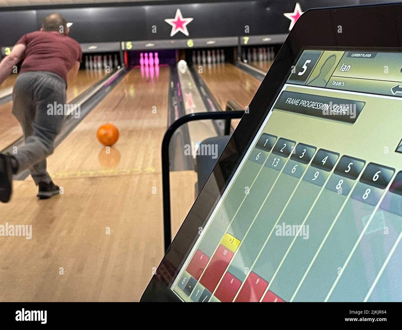 Man bowling in bowling alley Stock Photo Alamy