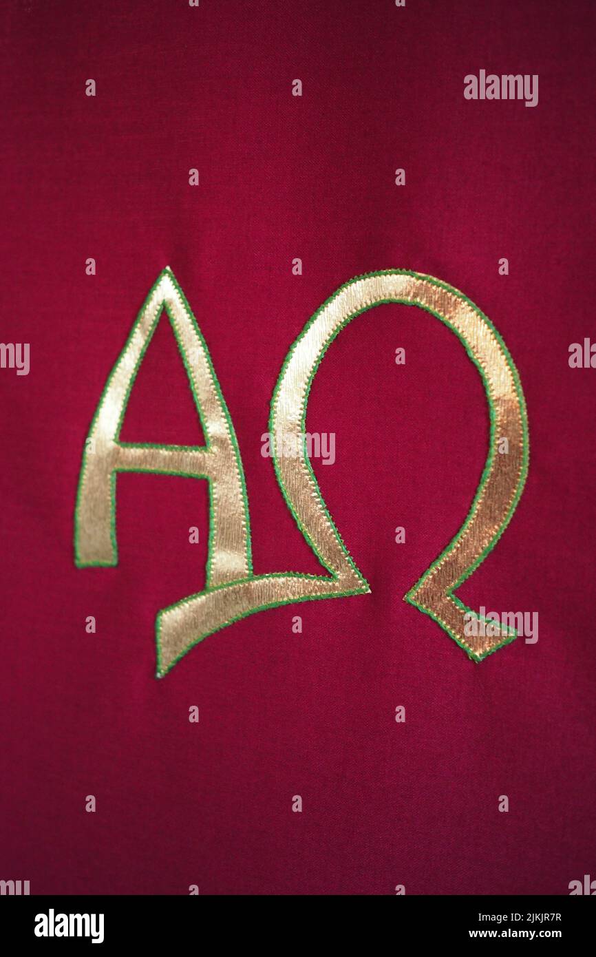 Altar cloth with embroidered gold Christian Alpha and Omega symbols Stock Photo