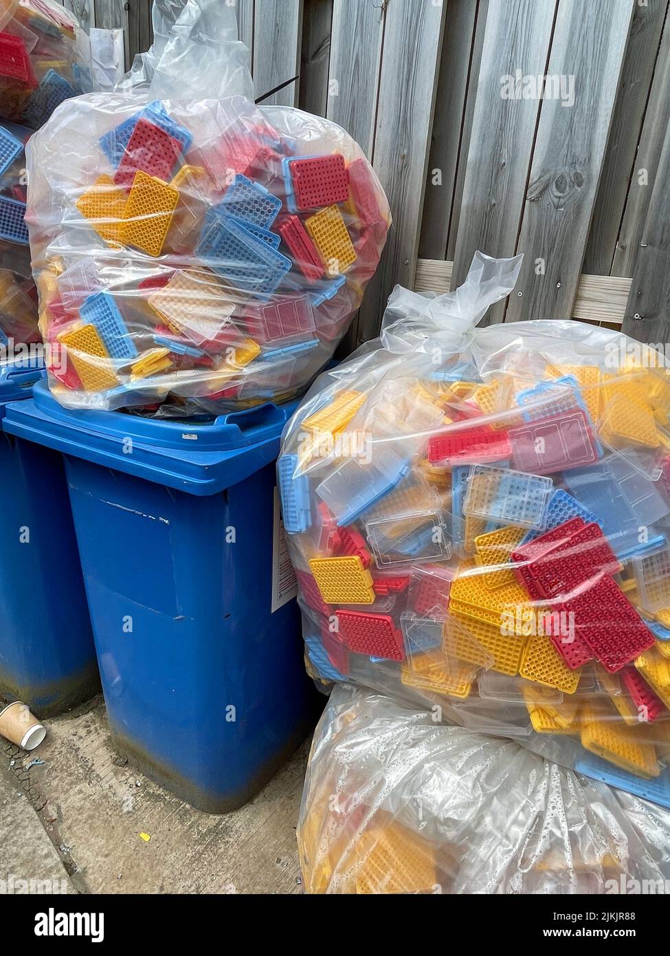 Plastic waste piled on waste bins Stock Photo Alamy